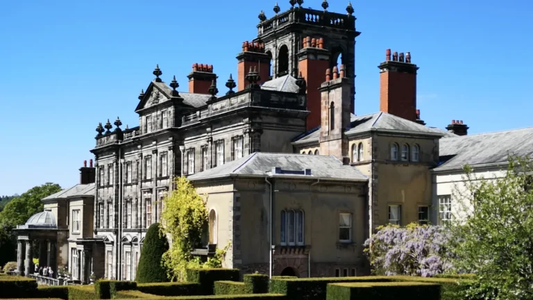 The historic Biddulph Grange building surrounded by spring vegetation