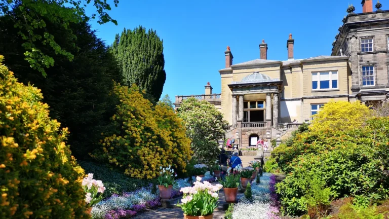 Spring garden in front of the historic building at Biddulph Grange Garden