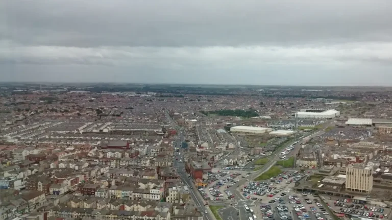 View of Blackpool from the tower, with the city skyline dominating the frame and cloudy skies at the top.