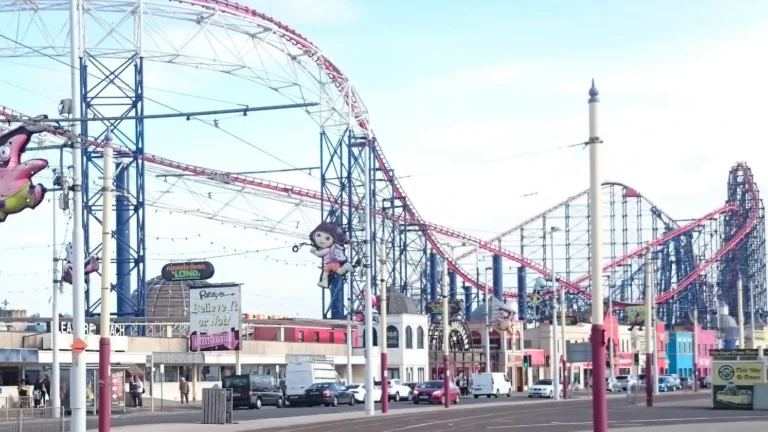 This guide to Blackpool will also show you an abstract detail of entertainment architecture: the intersecting, twisted tracks of a roller coaster against the sky at Blackpool Pleasure Beach amusement park.