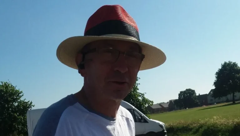 The author of the glog during a late afternoon walk, wearing a colourful hat to shield his face from the sun, during chemotherapy.