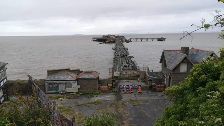 The old Birnbeck Pier in Weston-super-Mare leading from the mainland to the island, visible in a state of coastal ruin.