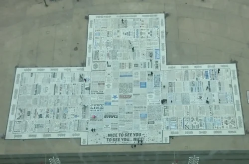 View from Blackpool Tower of the seafront with a giant newspaper – a unique bird's-eye view of street art in England