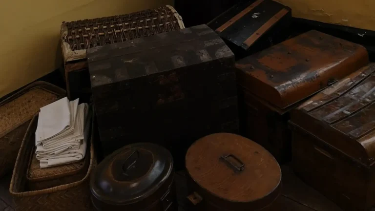 Vintage storage chests, baskets and metal containers in the servants’ quarters at Shugborough Estate.