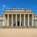 Front elevation of Shugborough Mansion at Shugborough Estate in Staffordshire, viewed from the main forecourt with its grand neoclassical portico and columns.