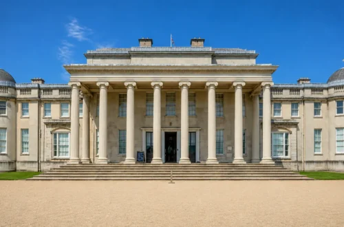 Front elevation of Shugborough Mansion at Shugborough Estate in Staffordshire, viewed from the main forecourt with its grand neoclassical portico and columns.